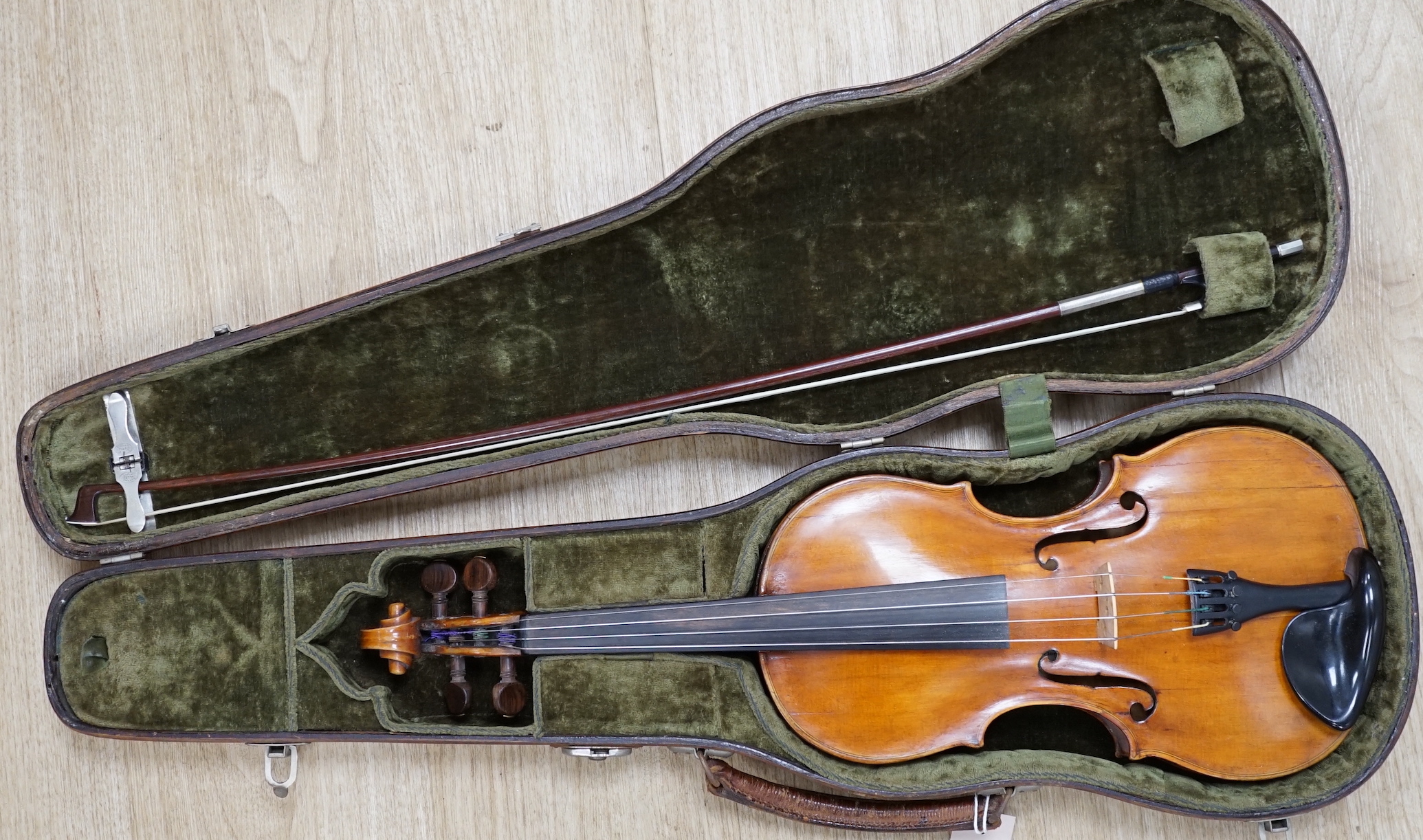 An early 19th century cased Italian violin labelled Florentus Florenus, body length 35cm, with a French silver mounted bow stamped Cuniot Hury, both in a fine Hill style case CITES Submission reference 6VGB2X83